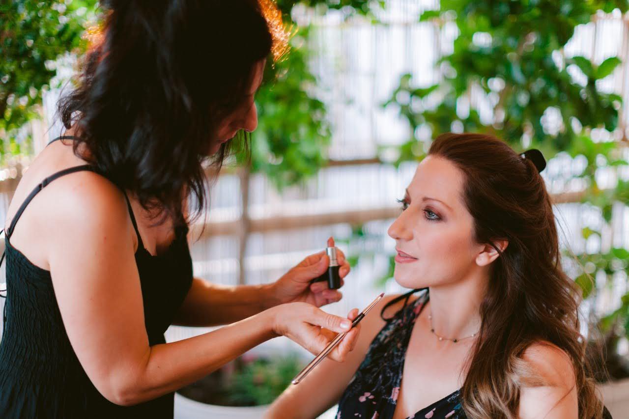 Vicky applying makeup